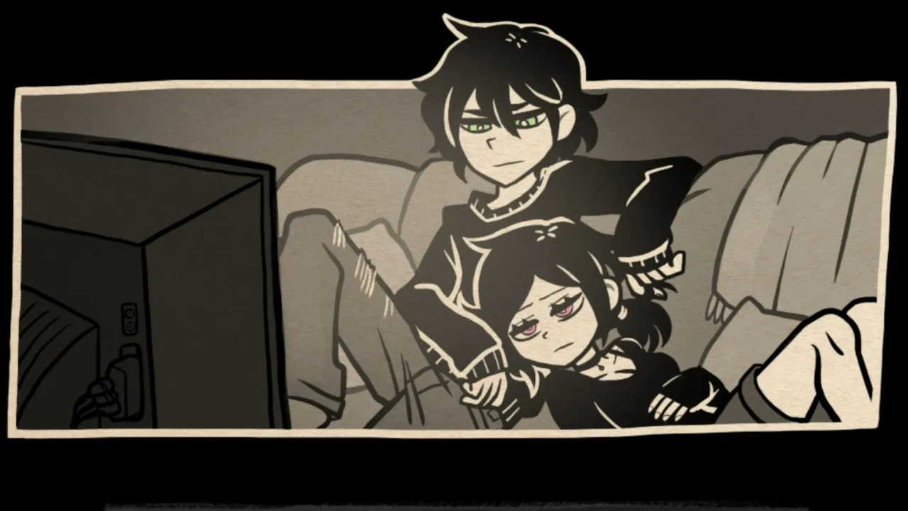 Andrew and Ashley sitting together watching TV in a dark room